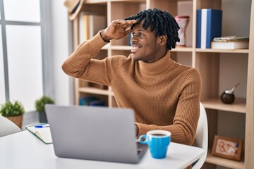 Sticker - Young african man with dreadlocks working using computer laptop very happy and smiling looking far away with hand over head. searching concept.