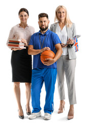 Canvas Print - Teachers with UK flag, books and ball on white background