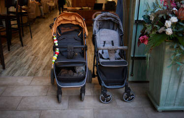 empty baby stroller near the open entrance to the store.