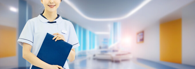 A nurse in a white coat working at a hospital. Caregiver. Medical doctor. Wide image for banners, advertisements.