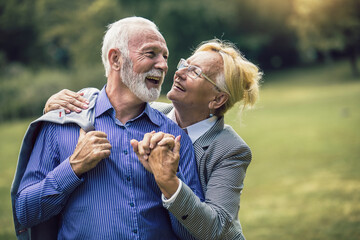 Portrait of beautiful senior couple posing in the park