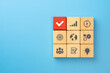 Business process management, Wooden cubes with business strategy icons on blue background. copy space