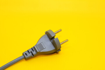 Photo of power plug on a yellow background