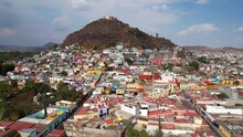 Drone Footage Of Atlixco City. Shows The Colorful Houses And The Famous Church On The Top Of San Miguel Hill. 
The Remarkable Magic Town In Puebla.