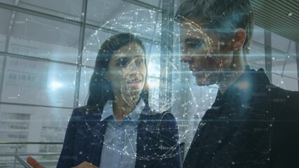 Canvas Print - Animation of globe of network of connections over two diverse businesswomen discussing at office