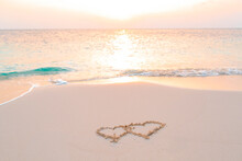 Handwritten Two Heart On Sand On Maldives Island, Concept Of Luxury Travel And Greetings For Valentine's Day