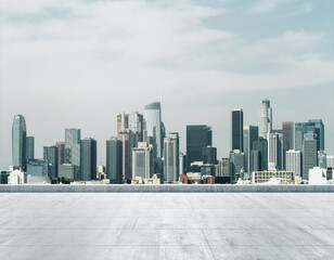 Empty concrete dirty rooftop on the background of a beautiful LA city skyline at morning, mock up