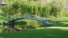 Beautiful Shot Of A Small Bridge Over The River In A Park