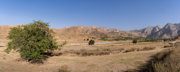 Canvas Print - Rural mountain landscape panorama in Mazar-i-Sharif countryside near Penjikent or Panjakent, Sughd region, Tajikistan