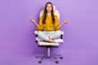© deagreez - Full size portrait of positive calm person sit leather chair meditate retreat isolated on purple color background