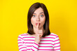 © deagreez - Closeup photo of young attractive funny girl keeping secret isolated on yellow color background