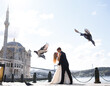 Couple Of Brides Standing On City and Sea Background In Istanbul