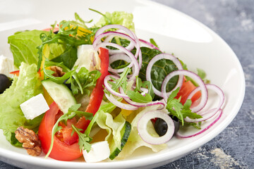 Wall Mural - greek salad on the white plate