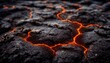 Black soil and hot magma flowing during eruption macro view