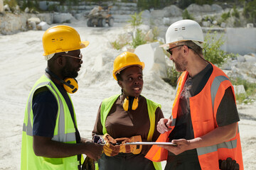 Aufkleber - Two African American workers of marble quarry talking to their foreman with tablet during discussion of points of new working project