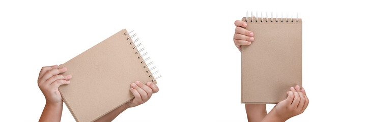 Wall Mural - Notepad isolated on white background. Brown notepad made from recycled paper on a white background in the hands of a child