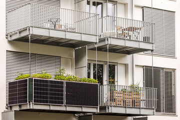 Wall Mural - Solar panels on Balcony of Apartment Building in City. Modern Balcony with Solar Panel.