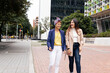 © Manolo Ramos - a Latin adult two women walking on the street