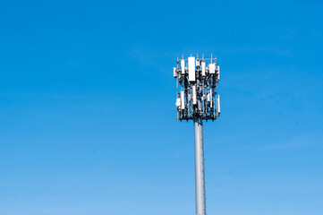 Cell Tower against blue sky with large side for text