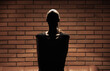 © kieferpix - unknown female person silhouette unrecognizable woman in a dark room