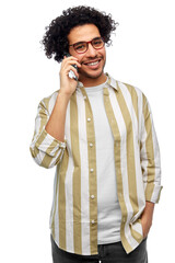 Wall Mural - people, communication and technology concept - happy smiling man in glasses calling on smartphone over white background