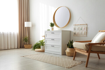 Sticker - Stylish room interior with chest of drawers and round mirror