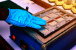 © Oilprakorn - Mechanic's hands are changing the tablet screen.