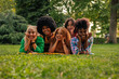 © bernardbodo - Portrait of diverse girls lying on lawn