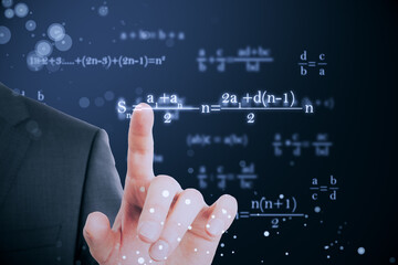 Wall Mural - Close up of businessman hand pointing at glowing mathematical formulas on blue background. Education, knowledge and statistics concept.