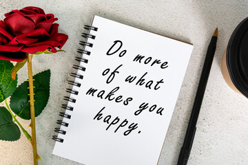 Wall Mural - Motivational quote on a note book with disposable coffee cup, pen and roses.