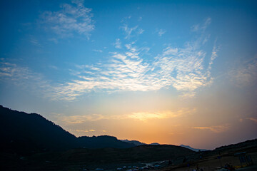 Wall Mural - Sunrise view of Tehri mountains. Scenery sunrise over Tehri Lake, Uttarakhand. Tehri Dam, the tallest dam in India and Tehri dam is Asia's largest man-made lake.