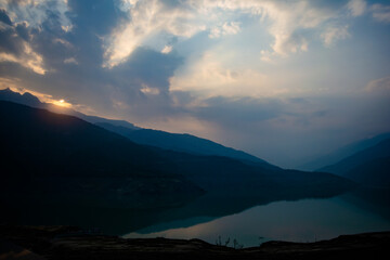 Wall Mural - Sunrise view of Tehri mountains. Scenery sunrise over Tehri Lake, Uttarakhand. Tehri Dam, the tallest dam in India and Tehri dam is Asia's largest man-made lake.