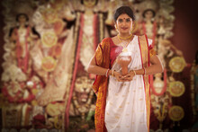 Bengali Woman Standing With Dhunuchi At Puja Pandal On The Occasion Of Durga Puja