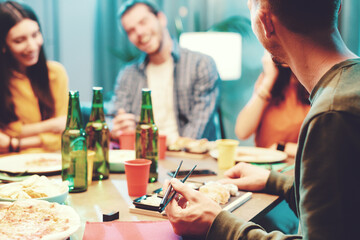 Cheerful friends having dinner together