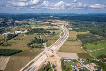 Canvas Print - Drone photo of construction site of express road S7, view in Ruda village near Tarczyn city, Poland