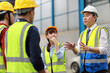© feeling lucky - Group of asian technician engineer and businessman in protective uniform standing and discussing, researching, brainstorming and planning work together with hardhat at industry manufacturing factory