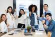 © crizzystudio - business team celebrates corporate victory together in the office, happy overjoyed professionals group rejoices company victory, teamwork success win triumph concept at the conference table