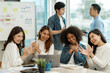 © crizzystudio - business team celebrates corporate victory together in the office, happy overjoyed professionals group rejoices company victory, teamwork success win triumph concept at the conference table