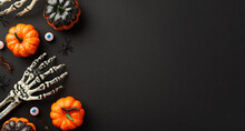 Halloween Scary Decorations Concept. Top Panoramic View Photo Of Skeleton Hands Pumpkins Eyes Centipedes And Spiders On Isolated Black Background With Copyspace