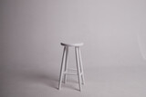 Fototapeta Paryż - White stool with shadow on white background. Location in studio with tabouret on white background