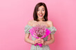 © deagreez - Photo of excited funny lady wear green clothes smiling holding flowers bouquet isolated pink color background