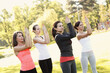 © racool_studio - A group of healthy, beautiful, athletic women in sporty clothes doing yoga in the park.