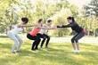 Group of people doing flexibility exercises at the park