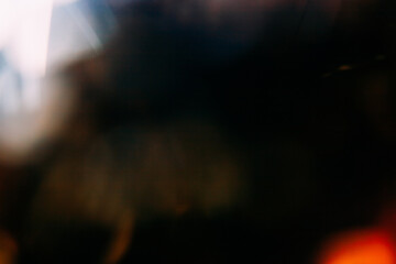 Wall Mural - lens flare overlay. bokeh light. blur radiance. defocused orange golden white color glow on dark nig
