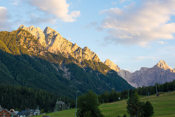 Wall Mural - The Alpine landscape near Kranjska Gora in the Upper Carniola region of north west Slovenia. The mountain peaks from left to right - Rusica, Rigljica, Rusa Pec, Spik, Frdamane Police, Drcev Rut, Krisk