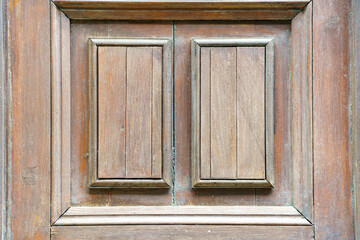 Part of an old wooden door with two rectangles