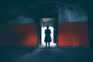 Wall Mural - Mysterious man with hat in an old manor