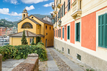 Poster - Narrow street between colorful buildings at the port of Santa Margherita, Ligure, Italy.