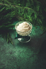 Christmas Dessert On A Green Background, With A Christmas Tree And Copy Space