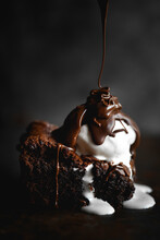 Chocolate Brownie With Ice Cream And Melted Chocolate